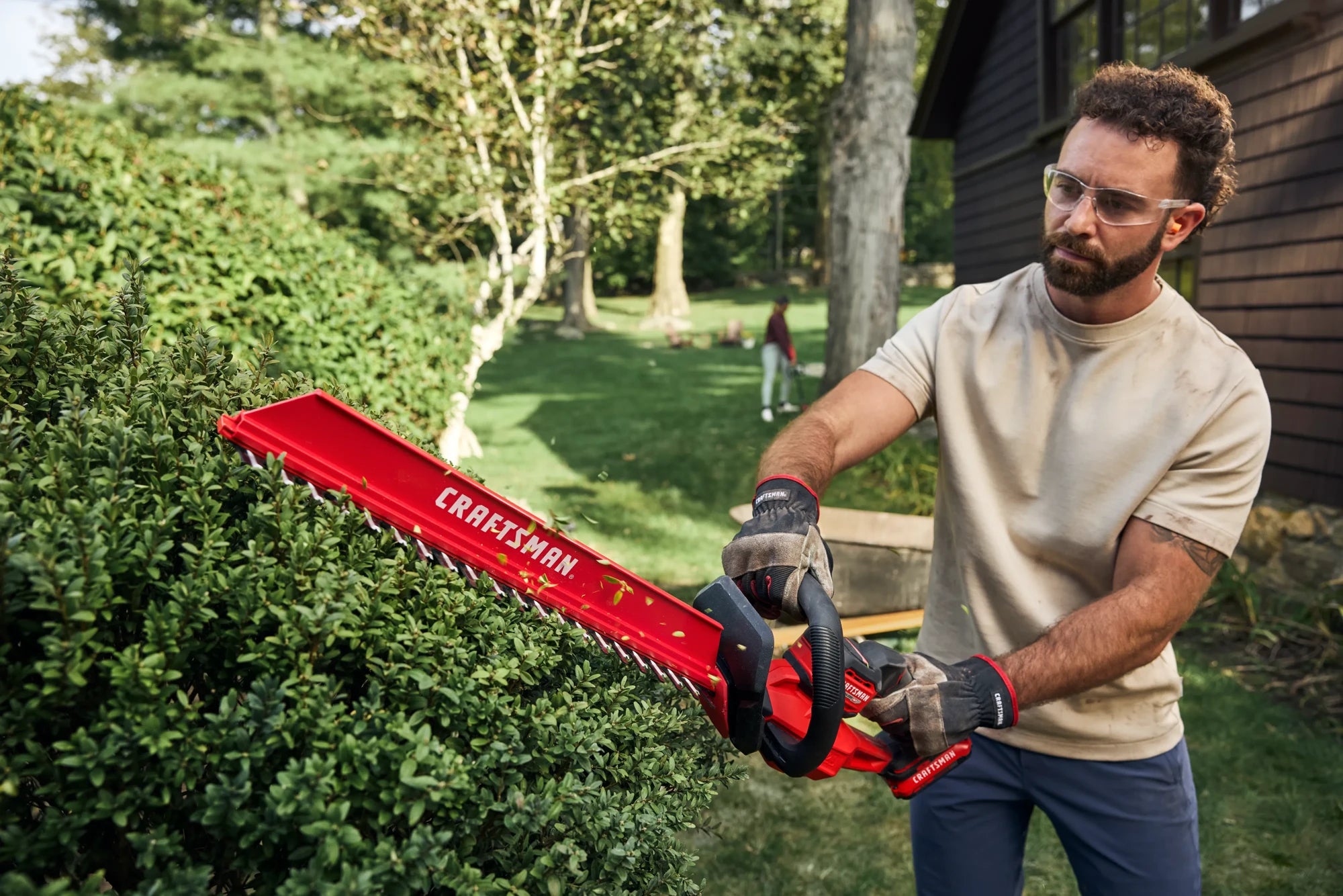 CRAFTSMAN hedge trimmer in use