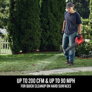 Photo of Craftsman cordless blower CMCBL710B used for clearing leaves on grass and sidewalk outdoors.