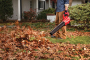 Photo of Craftsman cordless leaf blower CMCBL720B in use outdoors, blowing leaves on a lawn.