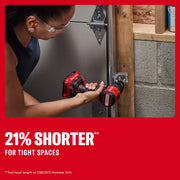 A person using a red CRAFTSMAN cordless drill (model CMCD716B) to install or tighten a metal fixture in a confined area near