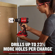 Photo of CRAFTSMAN CMCD725D2 cordless drill in use with a hole saw attachment drilling into wood panel.