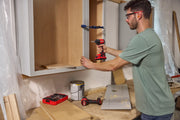 Photo of Craftsman CMCF811D1 impact driver used for cabinet installation in a workshop.