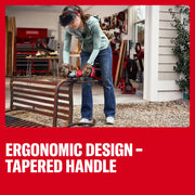 Photo of a person using Craftsman cordless angle grinder CMCG452B to cut metal bench outdoors, sparks flying.