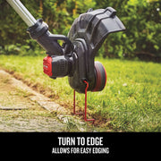 Photo of CRAFTSMAN grass trimmer CMCST900B edging lawn near sidewalk.