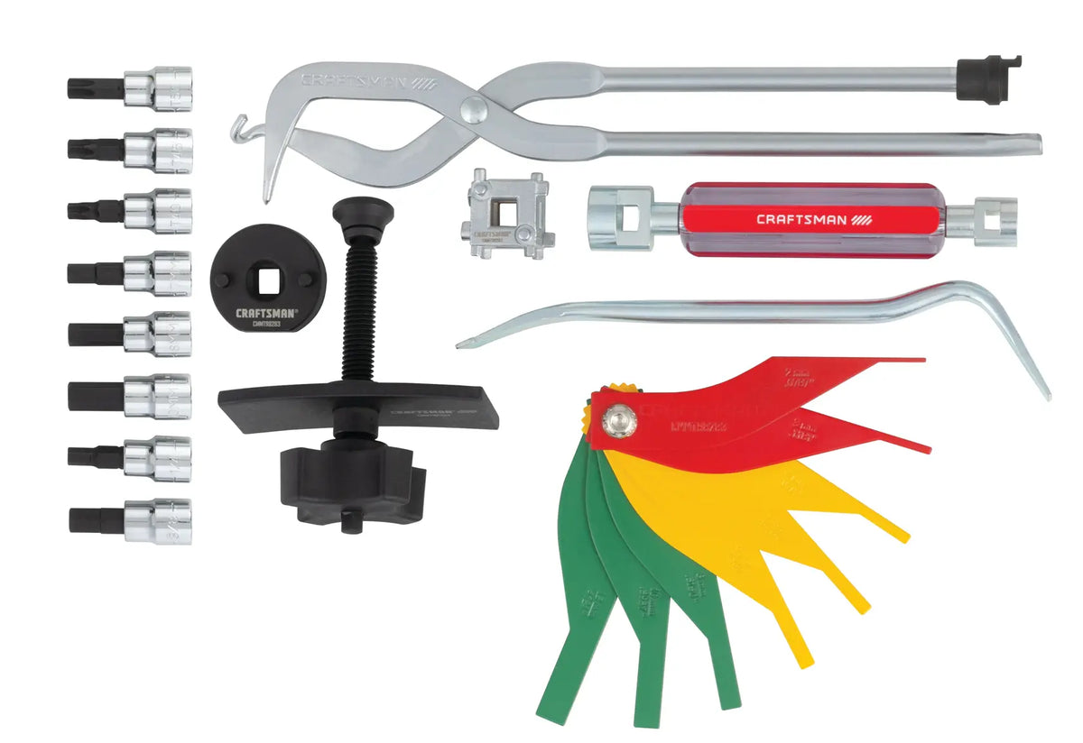 Craftsman CMMT98283 automotive tool set, assorted tools and adapters, top-angle on white background.