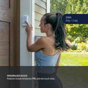 Photo of woman using outdoor keypad entry, CRAFTSMAN CMX348, home security category, garden background.