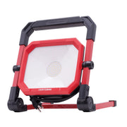 Photo of CRAFTSMAN LED work light CMXELAYMPL1028, red frame, front angle, with handle and power cord.