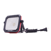 Front angle photo of CRAFTSMAN LED work light with stand, black and red, SKU CMXELAYMPL1032, power cord attached.