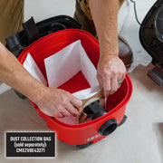 Photo of CRAFTSMAN vacuum dust collection bag installation, model CMXEVBE17040, with red canister.