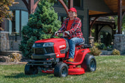 Dual bar bumper being attached to front on lawn mower.