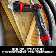 Craftsman garden hose nozzle CMXMWBB16636, black and red, shown on wood planks, angled view.