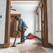Photo of Craftsman wet/dry vacuum CMXZVBE38606 cleaning a wooden floor in a renovation space.
