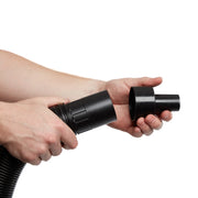 Photo of CRAFTSMAN vacuum hose adapter CMXZVBE38665, black plastic, held in hands, side angle.