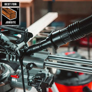 CRAFTSMAN CMXZVBE38677 graphics showing black vacuum hose attached to saw at jobsite.