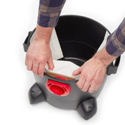 Photo of Craftsman CMXZVBE38767 vacuum base with hands installing paper filter, front angle on white background.